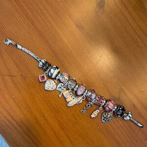 Pandora style sterling silver charm bracelet 
(With 8 beads, 2 ends, 8 charms)